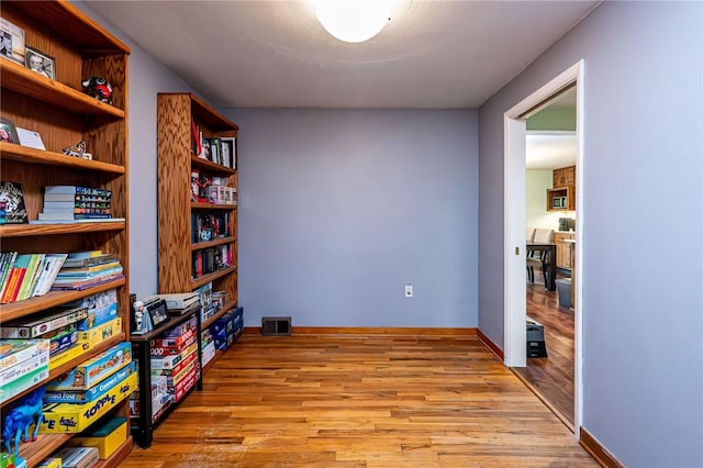 225 Circle Dr, White Oak, PA 15131 - interior space featuring visible vents, baseboards, and wood finished floors