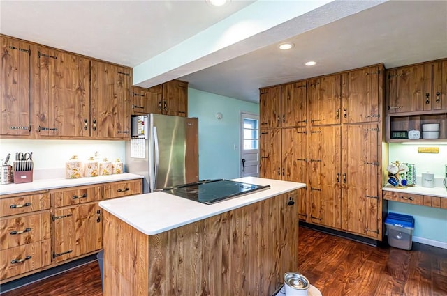 225 Circle Dr, White Oak, PA 15131 - kitchen with dark wood-type flooring, brown cabinets, freestanding refrigerator, and black electric cooktop