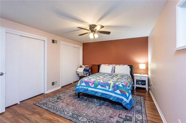 225 Circle Dr, White Oak, PA 15131 - bedroom featuring wood finished floors, baseboards, visible vents, and multiple closets