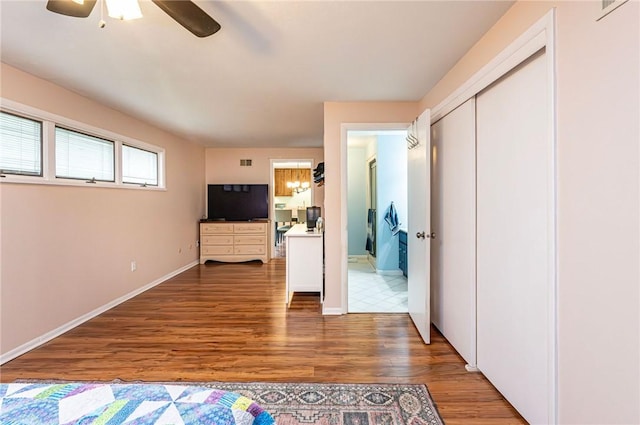 225 Circle Dr, White Oak, PA 15131 - unfurnished bedroom with wood finished floors, ceiling fan, and baseboards