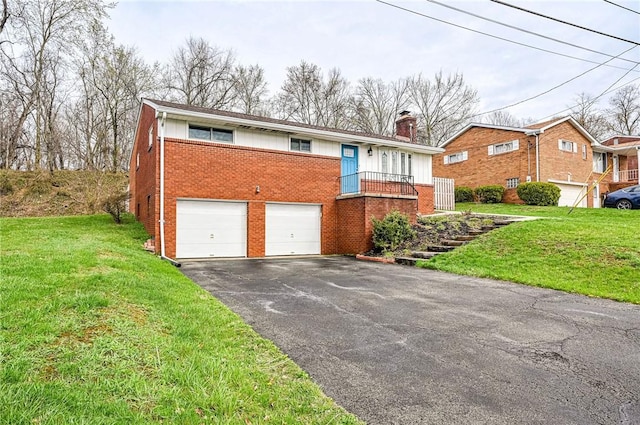 225 Circle Dr, White Oak, PA 15131 - view of front facade with a front lawn, brick siding, an attached garage, a chimney, and driveway