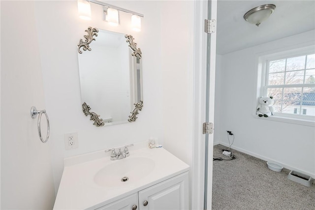 bathroom featuring baseboards and vanity