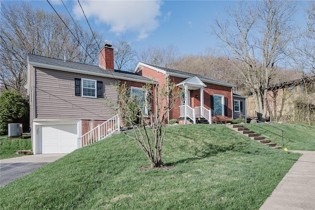ranch-style house with brick siding, an attached garage, cooling unit, and aphalt driveway