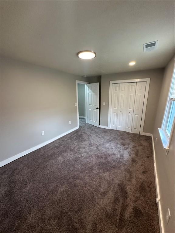 535 Grant Ave, Heidelberg, PA 15106 - unfurnished bedroom featuring a closet, visible vents, baseboards, and carpet floors