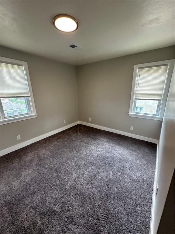 535 Grant Ave, Heidelberg, PA 15106 - unfurnished room with baseboards, visible vents, and dark colored carpet
