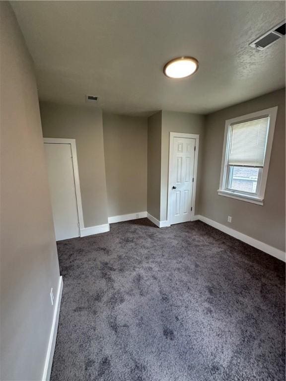 535 Grant Ave, Heidelberg, PA 15106 - unfurnished room featuring dark carpet, visible vents, and baseboards