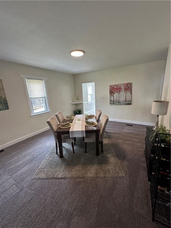 535 Grant Ave, Heidelberg, PA 15106 - dining room featuring baseboards and dark colored carpet