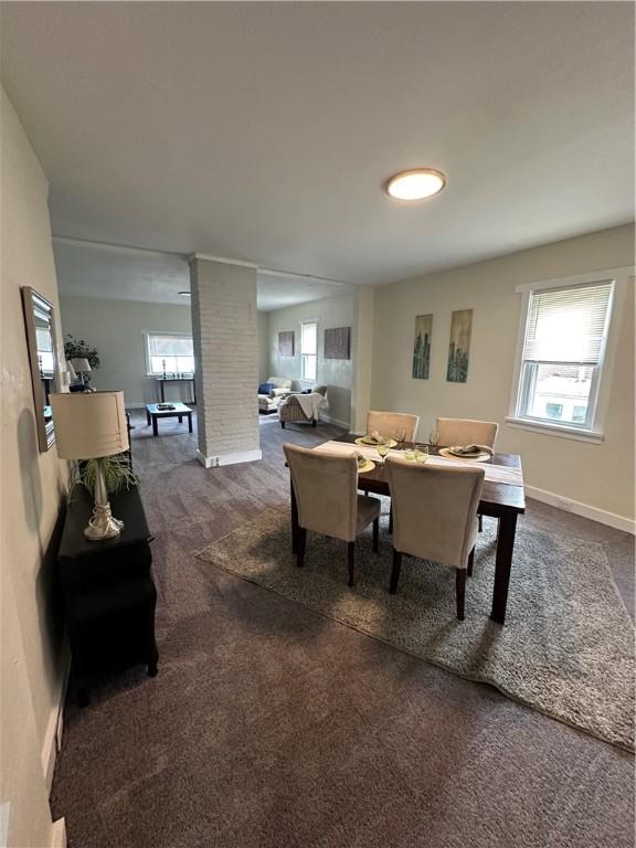 535 Grant Ave, Heidelberg, PA 15106 - living area with dark carpet, decorative columns, and baseboards