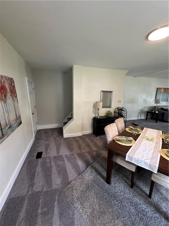 535 Grant Ave, Heidelberg, PA 15106 - carpeted dining space with baseboards and stairs