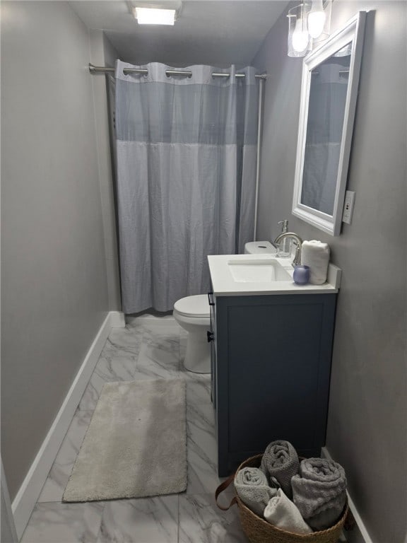 535 Grant Ave, Heidelberg, PA 15106 - bathroom with toilet, baseboards, marble finish floor, and vanity
