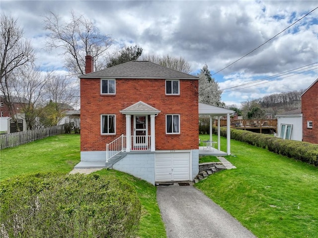 210 Verna Dr, Shaler, PA 15209 - view of front facade with an attached garage, brick siding, fence, and a front lawn
