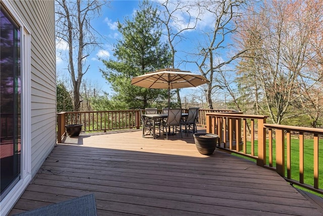 deck with outdoor dining area
