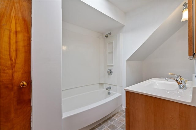 bathroom featuring vanity and  shower combination
