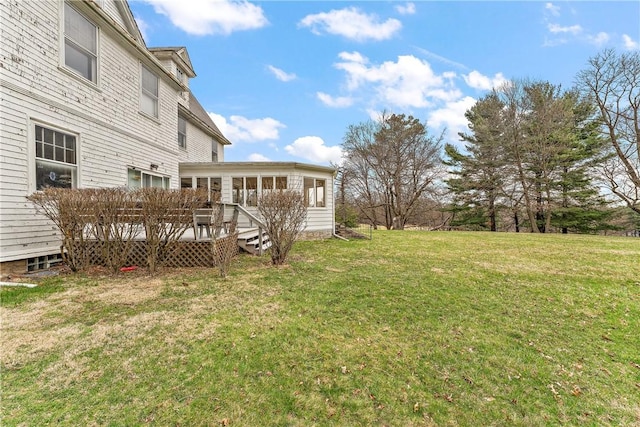 view of yard featuring a wooden deck