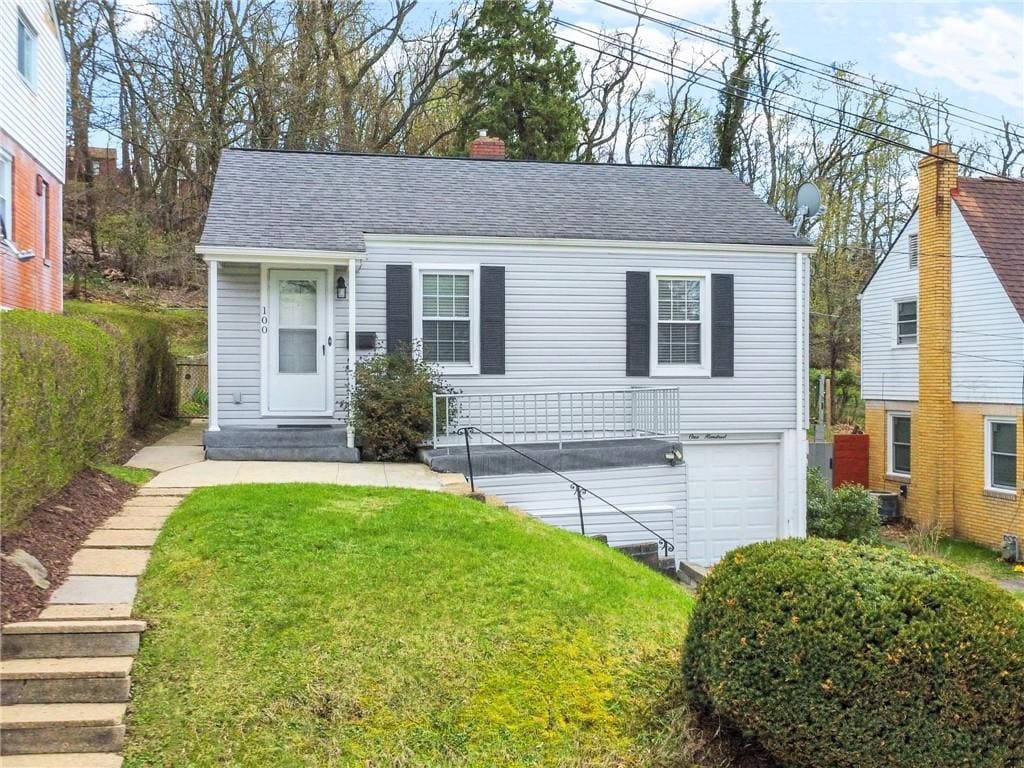 100 Hodgson Ave, Ingram, PA 15205 - ranch-style home featuring an attached garage, a shingled roof, a chimney, and a front yard
