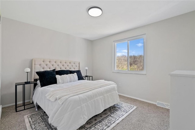 bedroom with carpet flooring, visible vents, and baseboards