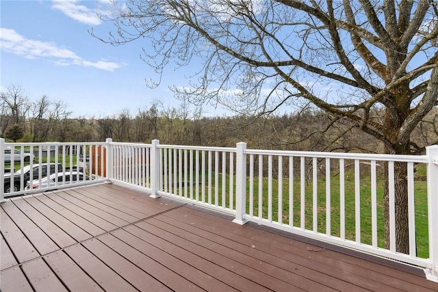 wooden deck featuring a wooded view