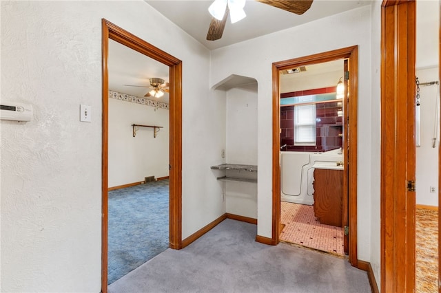 407 Maxwell Dr, Whitehall, PA 15236 - hall featuring arched walkways, independent washer and dryer, baseboards, and carpet floors
