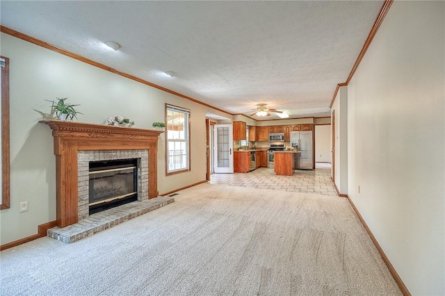 unfurnished living room featuring ornamental molding, light carpet, and a textured ceiling