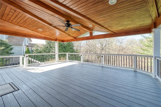 wooden deck featuring ceiling fan