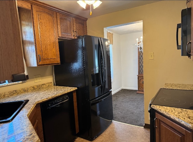 21 Garden Ter, Churchill Boro, PA 15221 - kitchen with black appliances, a sink, dark carpet, brown cabinetry, and light stone counters