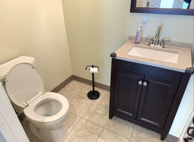 21 Garden Ter, Churchill Boro, PA 15221 - half bathroom with toilet, vanity, and tile patterned floors