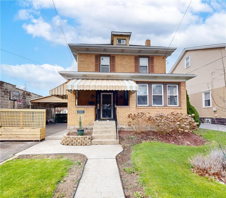 603 Ravenswood Ave, Ross Twp, PA 15202 - traditional style home featuring a front yard and brick siding
