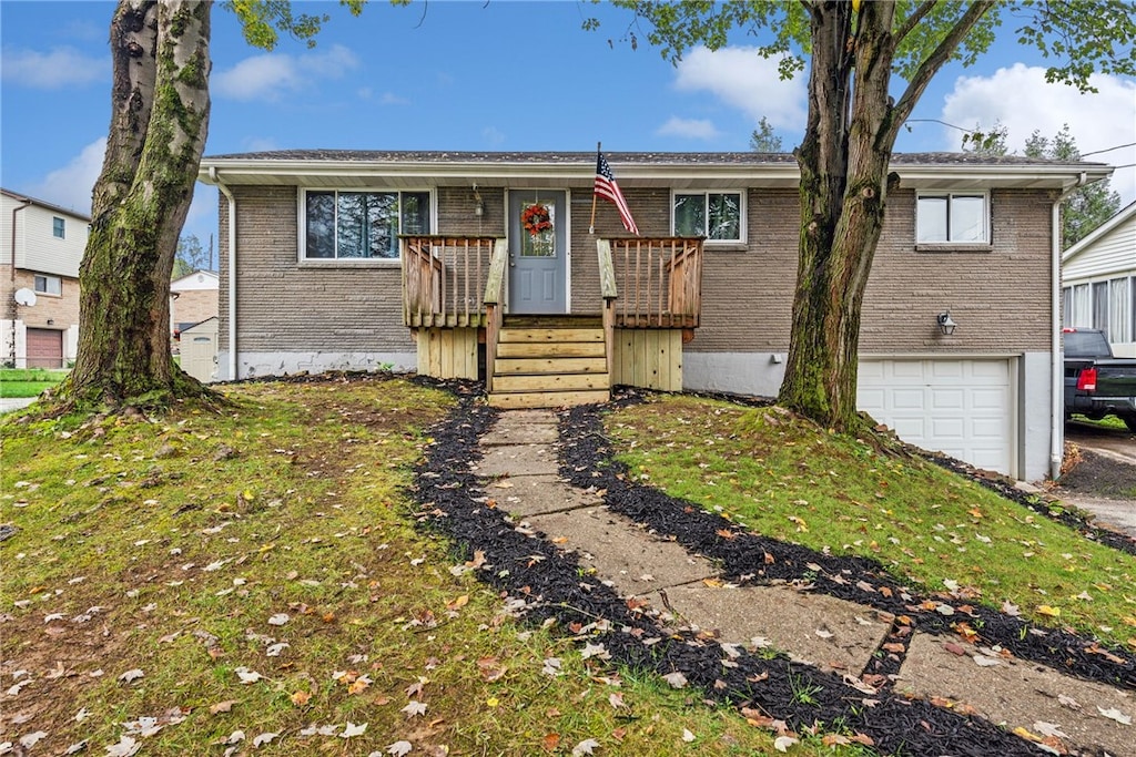 30 Martha Ave, Penn Twp Wml, PA 15644 - single story home with an attached garage, aphalt driveway, a wooden deck, and brick siding