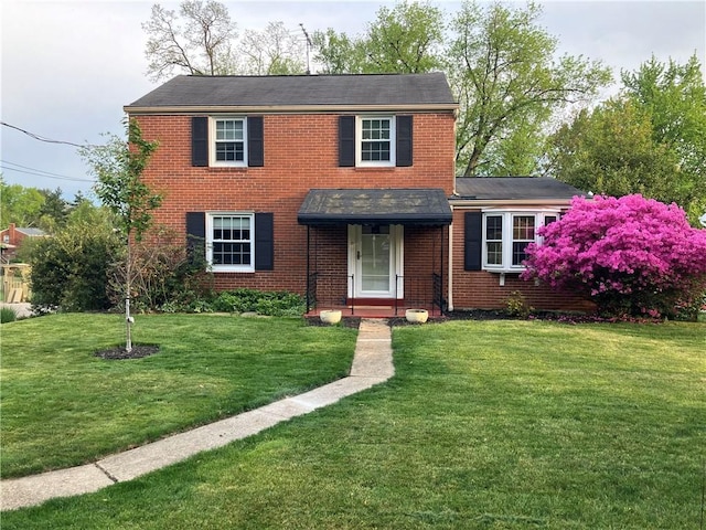 309 W Sutter, Shaler, PA 15116 - view of front facade featuring a front lawn and brick siding