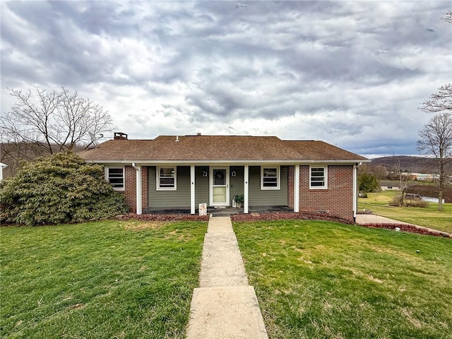 210 Locust St, Rural Valley Boro, PA 16249 - view of front facade featuring a front yard, roof with shingles, a chimney, and covered porch