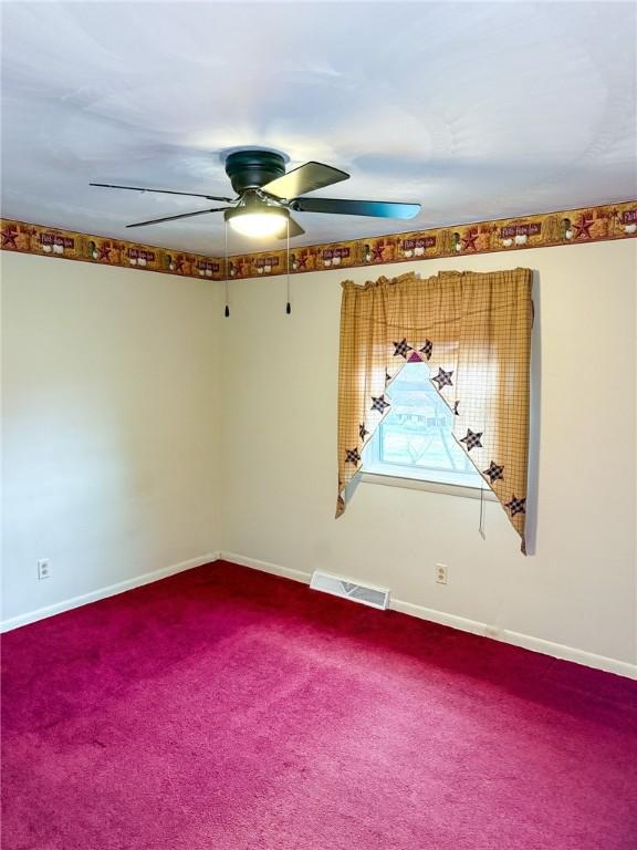 210 Locust St, Rural Valley Boro, PA 16249 - unfurnished room featuring ceiling fan, baseboards, visible vents, and carpet floors