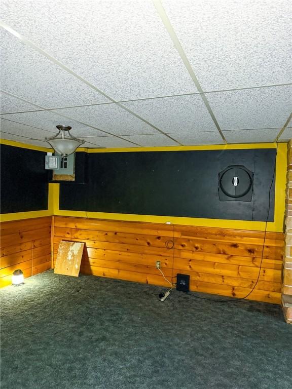 210 Locust St, Rural Valley Boro, PA 16249 - interior space with wooden walls, a drop ceiling, and carpet floors