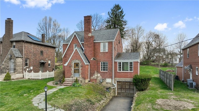 210 Morewood Rd, Shaler, PA 15116 - view of front of property featuring driveway, a front yard, brick siding, and a garage