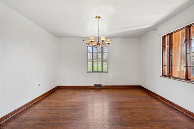 210 Morewood Rd, Shaler, PA 15116 - unfurnished room featuring wood finished floors, a chandelier, visible vents, and baseboards