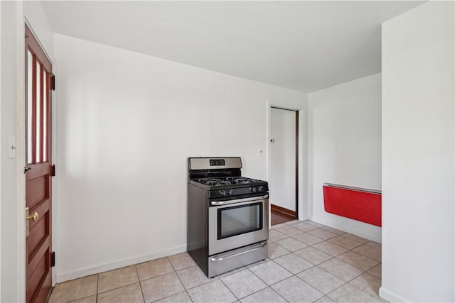 210 Morewood Rd, Shaler, PA 15116 - kitchen featuring baseboards, light tile patterned floors, and stainless steel range with gas cooktop