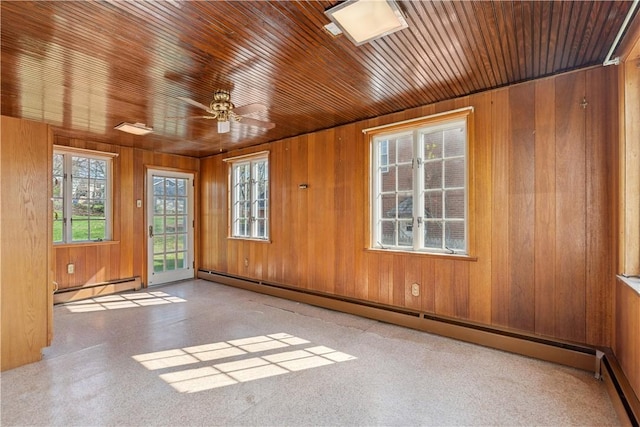 210 Morewood Rd, Shaler, PA 15116 - unfurnished room with a baseboard heating unit, wood walls, and a healthy amount of sunlight