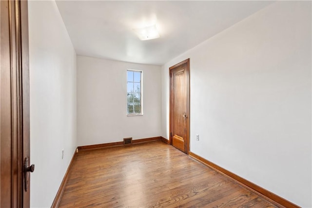 210 Morewood Rd, Shaler, PA 15116 - empty room with wood finished floors, visible vents, and baseboards