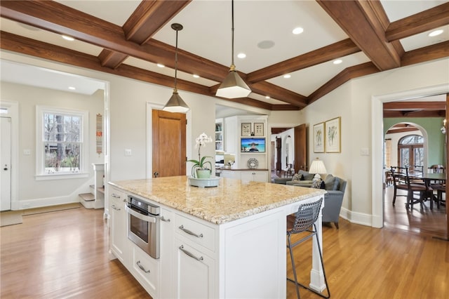 918 W Waldheim Rd, Fox Chapel, PA 15215 - kitchen featuring stainless steel oven, white cabinets, beam ceiling, coffered ceiling, and light wood-type flooring