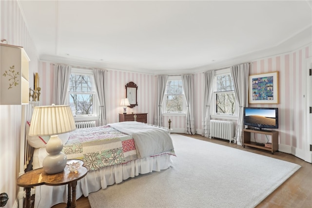 918 W Waldheim Rd, Fox Chapel, PA 15215 - bedroom featuring radiator, wallpapered walls, wood finished floors, and baseboards