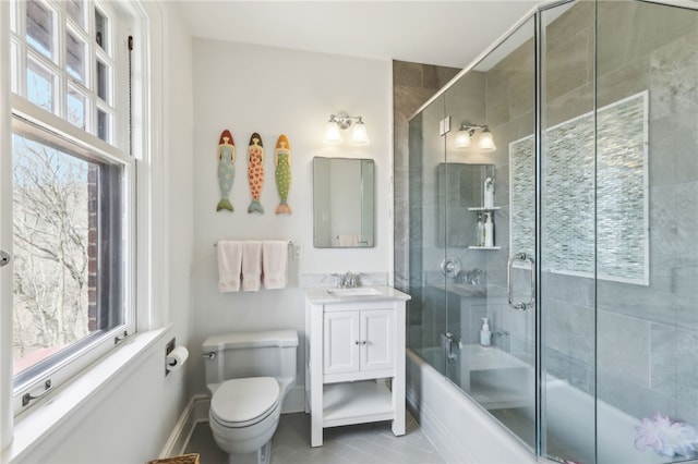 918 W Waldheim Rd, Fox Chapel, PA 15215 - bathroom with healthy amount of natural light, combined bath / shower with glass door, vanity, and toilet