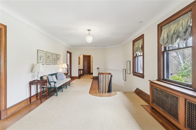 918 W Waldheim Rd, Fox Chapel, PA 15215 - sitting room featuring arched walkways, radiator heating unit, baseboards, and crown molding