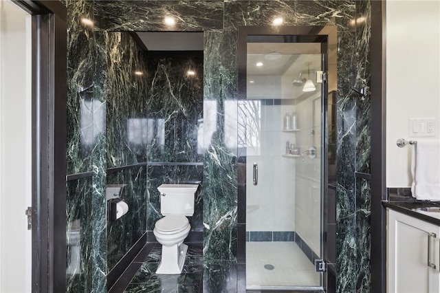 918 W Waldheim Rd, Fox Chapel, PA 15215 - bathroom featuring toilet, vanity, a shower stall, tile walls, and marble finish floors