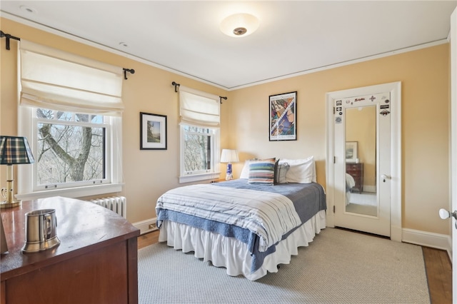 918 W Waldheim Rd, Fox Chapel, PA 15215 - bedroom featuring multiple windows, wood finished floors, ornamental molding, and baseboards