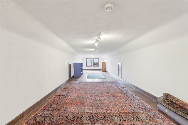 918 W Waldheim Rd, Fox Chapel, PA 15215 - hall featuring baseboards, lofted ceiling, and rail lighting