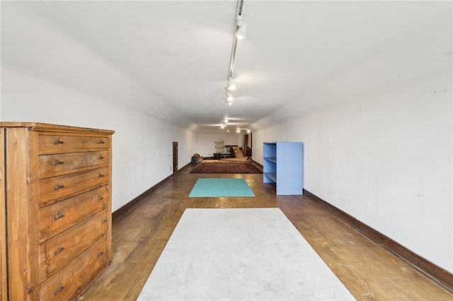 918 W Waldheim Rd, Fox Chapel, PA 15215 - unfurnished bedroom with track lighting, dark wood finished floors, and baseboards