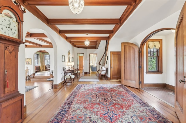 918 W Waldheim Rd, Fox Chapel, PA 15215 - foyer featuring arched walkways, healthy amount of natural light, wood finished floors, and beam ceiling