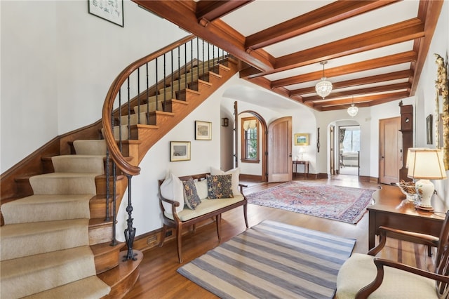 918 W Waldheim Rd, Fox Chapel, PA 15215 - stairs featuring arched walkways, wood finished floors, baseboards, and beamed ceiling