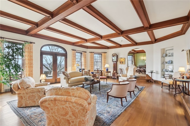 918 W Waldheim Rd, Fox Chapel, PA 15215 - living area with coffered ceiling, arched walkways, beamed ceiling, wood finished floors, and baseboards