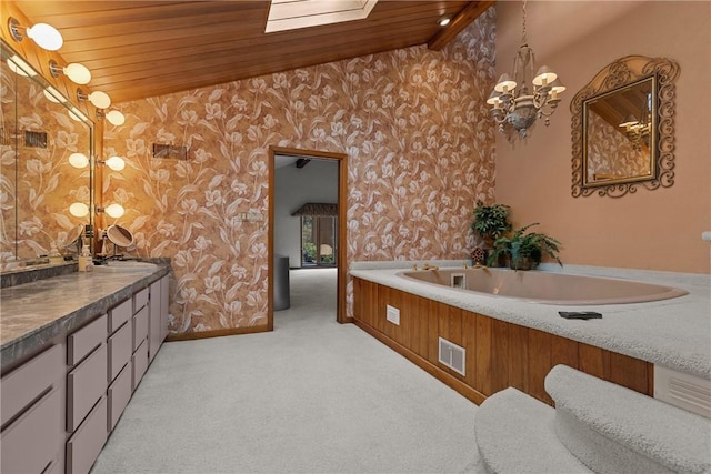 full bathroom with visible vents, a chandelier, vanity, vaulted ceiling, and wallpapered walls
