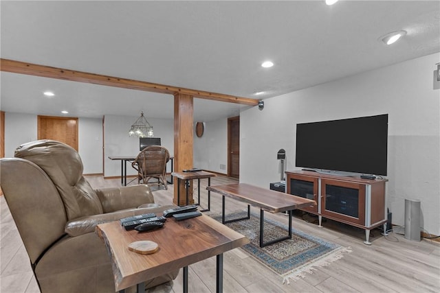 living room with recessed lighting, light wood-type flooring, and baseboards